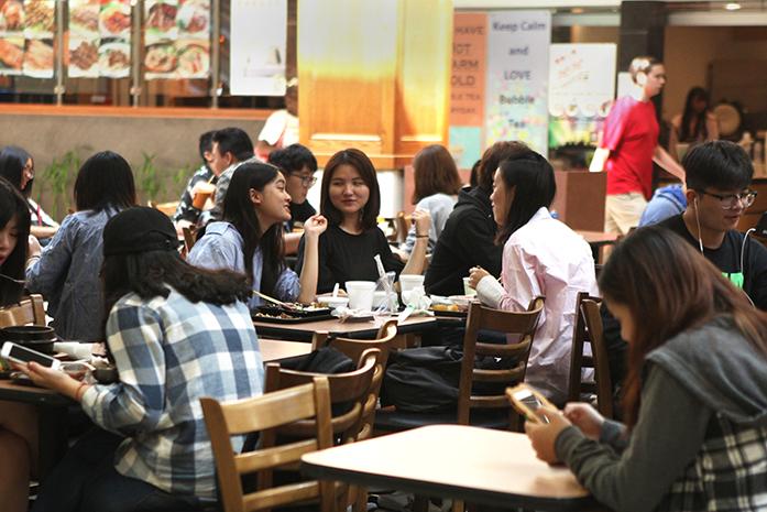 Students eat lunch in the food court of the Old Capitol Mall on Monday, September 12, 2016. International students account for more than 12% of the University of Iowas student body—more than double the population since 2002. (The Daily Iowan/Olivia Sun)