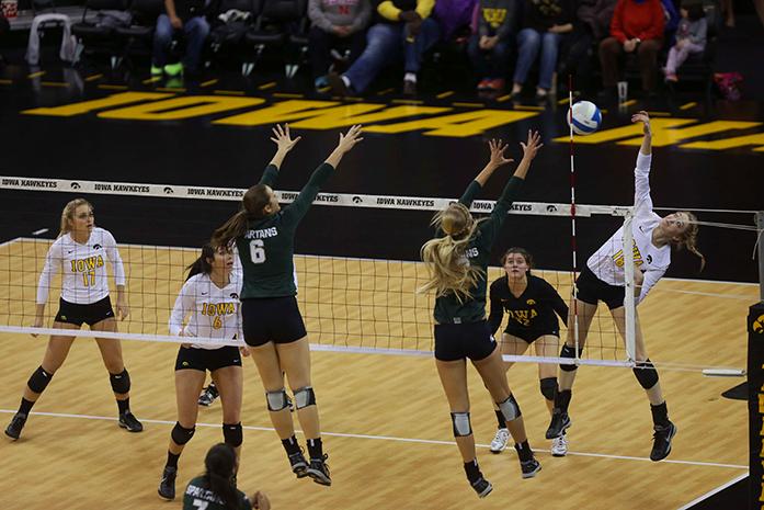 Iowa outside hitter Lauren Brobst spikes the ball during the Iowa-Michigan State match in Carver-Hawkeye Arena on Friday, Nov. 28, 2014. The Spartans defeated the Hawkeys, 3-0. (The Daily Iowan/Peter Kim)