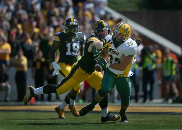 Iowa defensive end Josey Jewell attempts to block NDSU quarterback Easton Stick's pass to running back Chase Morlock during the Iowa-NDSU game at Kinnick on Saturday, Sept. 17, 2016. NDSU defeated Iowa in the final seconds of the game with a 37-yard field goal, 23-21. (The Daily Iowan/Margaret Kispert)