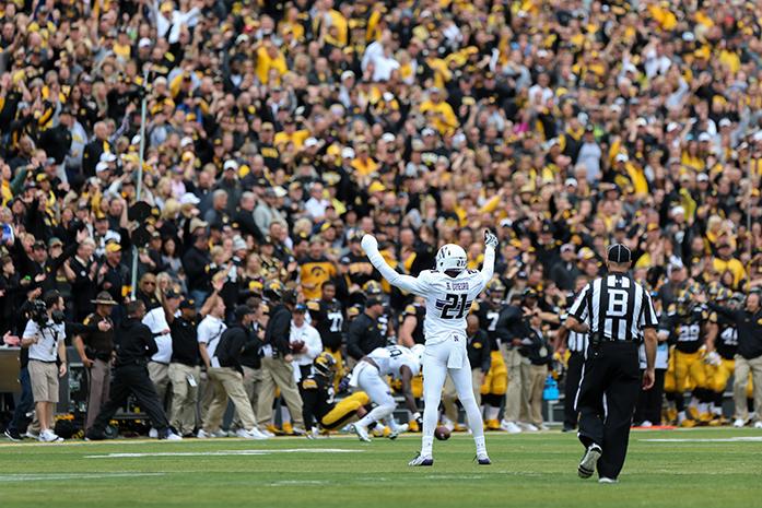Northwestern safety Kyle Queiro celebrates a defensive stop during the Iowa v. Northwestern game at Kinnick Stadium on Saturday, Oct. 1, 2016. The Hawkeyes fell to the Wildcats 38-31. (The Daily Iowan/Anthony Vazquez)