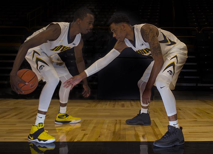 Iowas Maishe Dailey and Christian Williams dribbles the ball against each other during mens basketball media day in Carver-Hawkeye Arena on Wednesday. The Hawkeyes first game is Friday, Nov. 4, 2016 against Regis University in Carver at 7 p.m. (The Daily Iowan/Margaret Kispert)