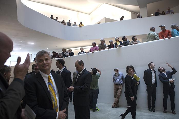 Audience members gather for the dedication of the University of Iowa's Visual Arts Building on Friday, Oct. 7, 2016. The minimalistic, interior architecture is by the Steven Holt Architects firm. (The Daily Iowan/Olivia Sun)