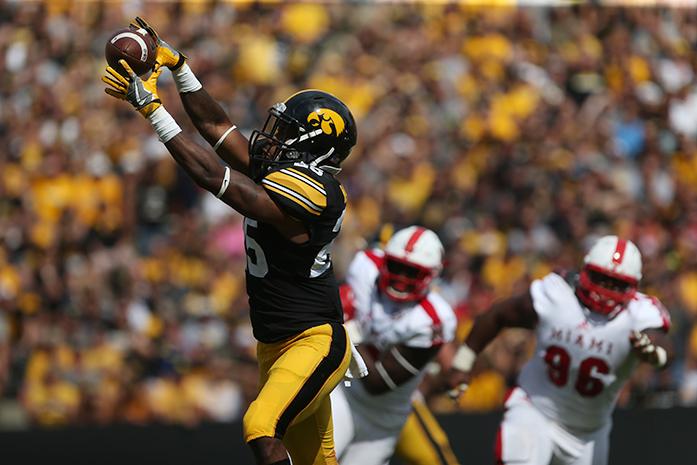 Iowa running back Akrum Wadley catches a pass from quarterback C.J. Beathard during the Iowa-Miami (Ohio) game at Kinnick on Saturday, Sept. 3, 2017. The Hawkeyes defeated the Redhawks, 45-21. (The Daily Iowan/Margaret Kispert)