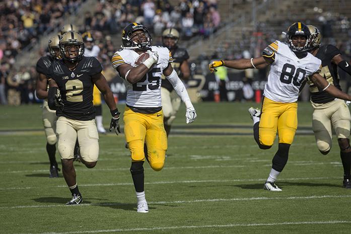 Iowa running back Akrum Wadley runs the ball for a touchdown in the first half of the Purdue, Iowa game at Ross-Ade Stadium on Saturday, October 15, 2016. The Iowa Hawkeyes defeated Purdue 49-35. (The Daily Iowan/Jordan Gale)