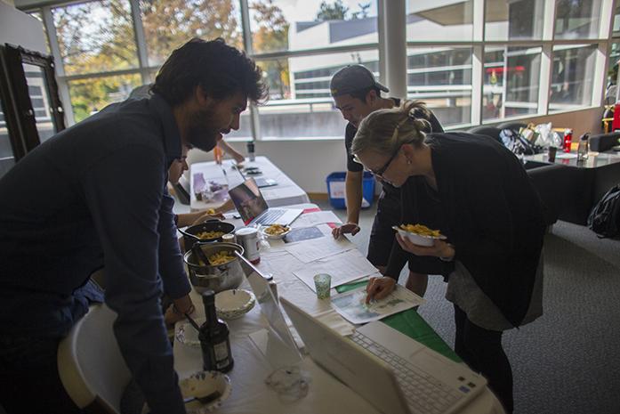 UI exchange student Lorenzo Sfragra talks with Assistant Director of Academic Success Initiatives at Tippie College of Business Jennifer Blair during the Language Tables at the Italy Language table in the Boyd Law Building on Tuesday, Oct. 17, 2016. The law school puts on a culture event every month with food and fun facts of different countries around the globe. (The Daily Iowan/Margaret Kispert)