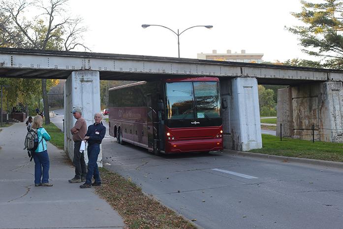 A+charter+bus+is+stuck+under+the+Iowa+City+rail+road+track+on+Iowa+Ave.+The+passengers+were+evacuated+and+Iowa+City+police+force+is+working+to+get+the+bus+removed.+%28The+Daily+Iowan%2FKarley+Finkel%29