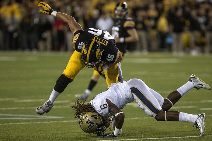 Hawkeye tight-end George Kittle avoids a tackle after a catch during a game against Pittsburgh on Saturday, Sept. 19, 2015. Kittle had two receptions for 7 yards total. The Hawkeyes defeated the Pittsburgh Panthers 27-24 on a last second field goal. (The Daily Iowan/Sergio Flores)