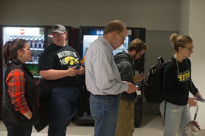 Congressman Dave Loebsack waits in line to vote on the ground floor of the Iowa Memorial Union with a group of students on Wednesday, Oct. 26, 2016 in Iowa City, IA. Congressman Loebsack came to campus to encourage students to vote early. (The Daily Iowan/Joshua Housing)