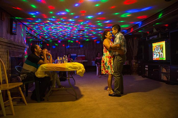 Felix and Maria Vazquez dance together at a family get together. Both have been a part of each other's lives since they met at the age of 10. Having started a new life in the United States, they have been through their fair share of happiness and grief. Through all the trying times in their lives they've always managed to persevere and come out on top. Their future plans are still up in the air, they plan to see their children through school with a stable job. As for what lies afterwards, still to be determined. There are ideas of going back to Mexico but having lived in the United Sates for over half their lives, this has now become home.(The Daily Iowan/ Anthony Vazquez)