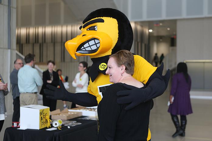 FILE - Herky poses with a UI Phil Was Here supporter at the Voxman Music Building on Wednesday, Oct. 12, 2016. PHIL, short for philanthropy, was launched in 2007, and works with alumni and UI supporters to give back to the campus community. (The Daily Iowan/Olivia Sun)