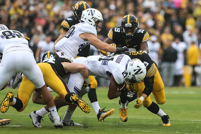 Northwestern running back Justin Jackson crashes into Iowa outside linebacker Josey Jewell during the Iowa v. Northwestern game at Kinnick Stadium on Saturday, Oct. 1, 2016. The Hawkeyes fell to the Wildcats 38-31. (The Daily Iowan/Anthony Vazquez)
