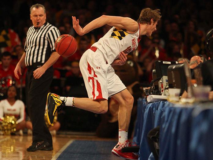 Marylands Jake Layman attempts to save the ball from going out of bounds against Iowa in the NIT semifinals at Madison Square Garden on Tuesday, April 2, 2013 in New York City, New York. The Hawkeyes defeated the Terrapins, 71-60.(The Daily Iowan/Adam Wesley)