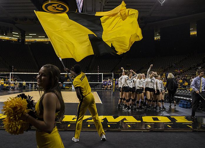 Iowa players cheer before beginning their set during a volleyball match at the Carver Hawkeye Arena in Iowa City on Friday, Oct 28, 2016. Iowa defeated Northwestern 3-1. (The Daily Iowan/Ting Xuan Tan)