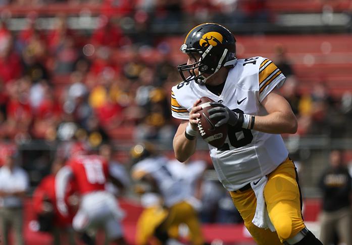 Iowa quarterback C.J. Beathard looks down field for an open player during the Iowa-Rutgers game at High Point Solution Stadium at Piscataway on Saturday, Sept. 24, 2016. The Hawkeyes defeated the Knights, 14-7. (The Daily Iowan/Margaret Kispert)
