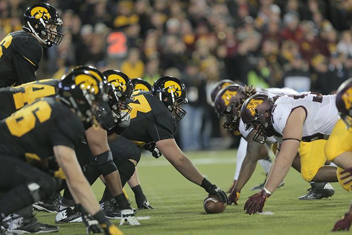 Iowa and Minnesota line up on the line of scrimmage during the Iowa-Minnesota game at Kinnick on Saturday, Nov. 14, 2013. The Hawkeyes defeated the Golden Gophers, 40-35 to stay perfect on the season. (The Daily Iowan/Margaret Kispert)