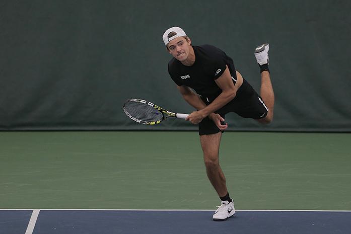 Iowa tennis player Nils Hallestrand severs the ball during the Big Ten doubles tournament in the Indoor Tennis complex on Friday, Nov. 6, 2015. (The Daily Iowan/Margaret Kispert)