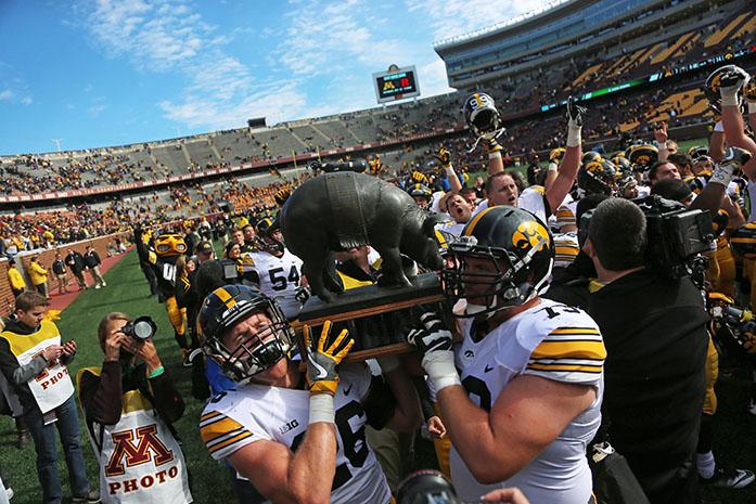Iowa players celebrate with the Floyd of Rosedale after the game between the Hawkeyes and Gophers at TCF Back Stadium on Saturday October 8, 2016. Iowa defeated Minnesota by the score of 14-7. (The Daily Iowan/ Alex Kroeze)
