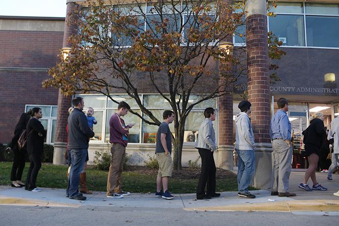 Voters wait in line outside of the Johnson County Administrative Building on Monday, Nov. 7, 2016 in Iowa City. Monday was the last day of early voting before Tuesdays General Election for the 2016 presidential nomination. (The Daily Iowan/file)
