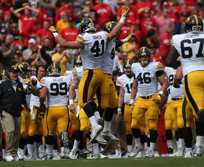 Iowa's Bo Bower and Josey Jewell celebrate a stopped Rutgers touchdown during the Iowa-Rutgers game at High Point Solution Stadium at Piscataway on Saturday, Sept. 24, 2016. The Hawkeyes defeated the Knights, 14-7. (The Daily Iowan/Margaret Kispert)