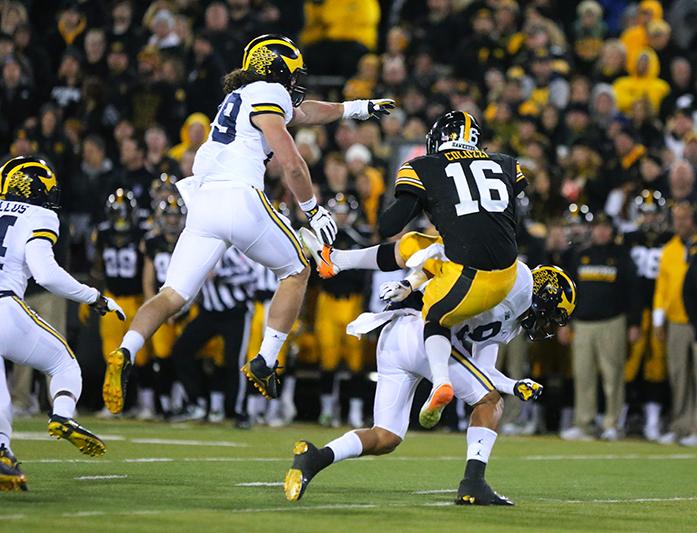 Iowa+punter+Ron+Coluzzi+gets+hit+on+a+second+straight+punt+attempt+during+the+game+between+Michigan+and+Iowa+at+Kinnick+Stadium+on+Saturday%2C+November+12%2C+2016.+Iowa+kicker+Keith+Duncan+nailed+a+33+yard+field+goal+as+the+time+ran+out+to+beat+the+No.+2+Wolverines+14-13.+%28The+Daily+Iowan%2F+Alex+Kroeze%29