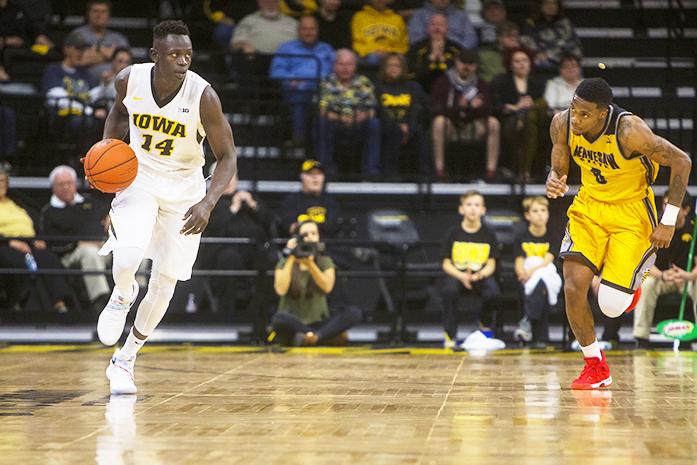 Iowa guard Peter Jok dribbles up court during a basketball game against Kennesaw State in Carver-Hawkeye Arena on Friday, Nov. 11, 2016. The Hawkeyes defeated the Owls, 91-74 in their season opener. (The Daily Iowan/Joseph Cress)