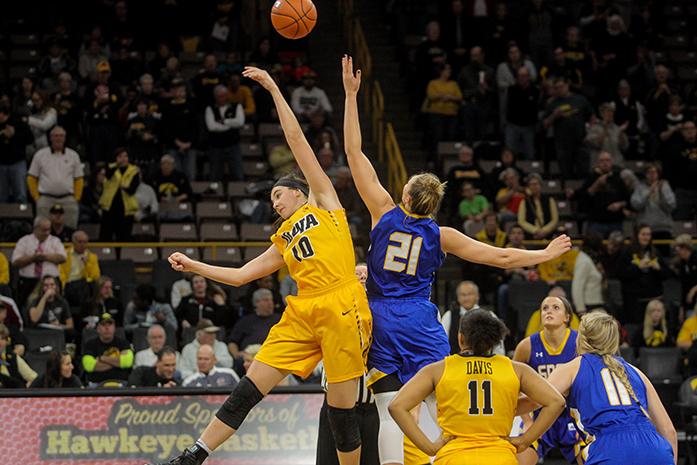 Centers; Clarissa Ober from the Jackrabbits and Megan Gustafson from the Hawkeyes, jump for the ball at the start of a basketball game in Carver-Hawkeye Arena on Sunday, Nov. 20, 2016. The Jackrabbits defeated the Hawkeyes, 66-64, in Iowa City. (The Daily Iowan/Osama Khalid)