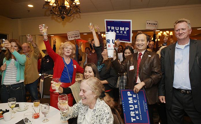 Donald Trump supporters toast and cheer at a Williamson County Republican watch party on election night at Old Natchez Country Club in Franklin, Tenn. on Tuesday, Nov. 8, 2016. (Shelley Mays/The Tennessean via AP)