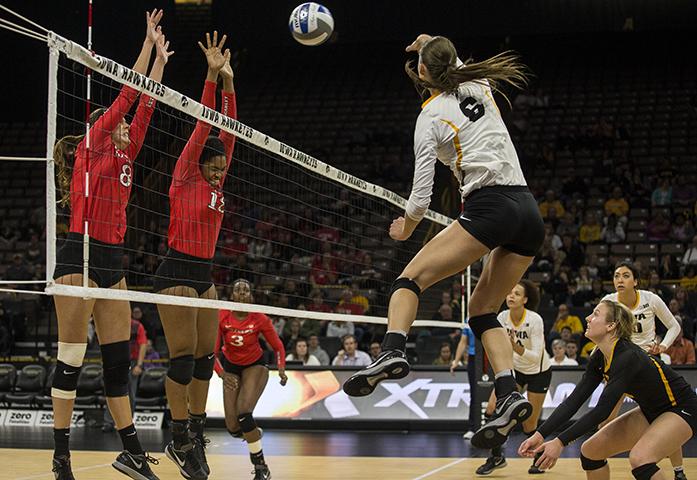Iowas no. 6 Kasey Reuter attacks with the ball during a volleyball match at the Carver Hawkeye Arena in Iowa City on Wednesday, Nov. 16, 2016. Iowa defeated Rutgers 3-1. (The Daily Iowan/Ting Xuan Tan)