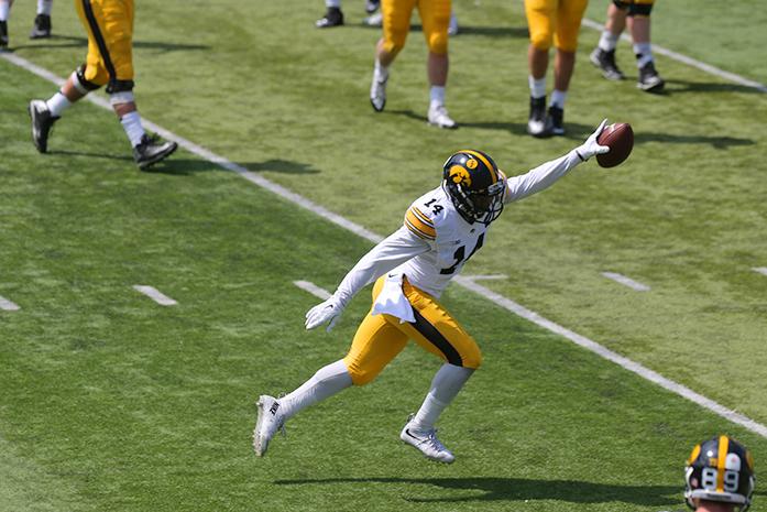 Iowa defensive back Desmond King celebrates after an interception at Kinnick Stadium on April 23, 2016. The defense beat the offense 20-18 in the spring game. (The Daily Iowan/ Alex Kroeze)