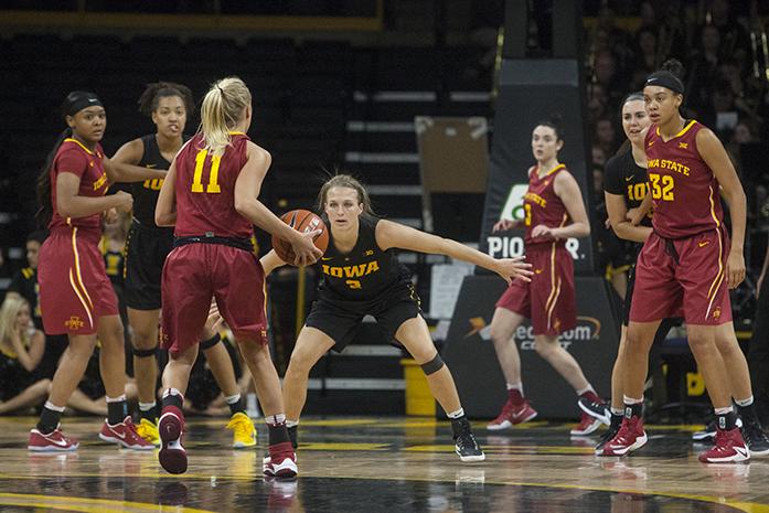 Iowa guard Makenzie Meyer stares down Iowa State guard Jadda Buckley during a women's basketball game in Carver Hawkeye-Arena on Wednesday, Dec. 7, 2016. The Hawkeyes defeated the Cyclones, 88-76. (The Daily Iowan/Joseph Cress)