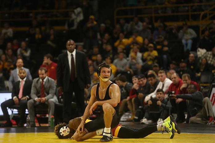 A whistle was blow during the 125-pounder match of Thomas Gilman and Iowa State's Markus Simmons during the Iowa-Iowa State match in Carver-Hawkeye Arena on Saturday, Dec. 10, 2016. Gilman defeated Simmons with a 19-4 tech fall in 5:09. Iowa defeated Iowa State, 26-9. (The Daily Iowan/Margaret Kispert)