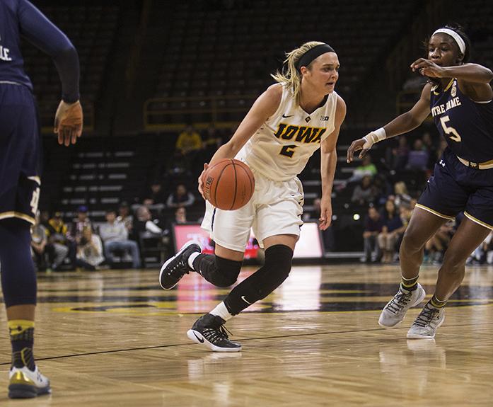 Iowa's no. 2 Ally Disterhoft drives the ball during a basketball match at the Carver Hawkeye Arena in Iowa City on Wednesday, Nov. 30, 2016. Notre Dame defeated Iowa 73-58. (The Daily Iowan/Ting Xuan Tan)