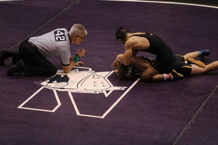 Iowa 141-pounder Christop Carton tries to pin South Dakotas Isaac Andrade during the 54th Annual Ken Kraft Midlands Championships in Welsh-Ryan Arena on Thursday, Dec. 29, 2016. Carton defeated Andrade by major decision, 10-2. (The Daily Iowan/Joshua Housing)