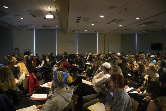 UI students watch a film during an event held by graduate students in the Iowa City Public Library on Wednesday, Dec. 14, 2016. Many students attended the event for extra credit. (The Daily Iowan/Joseph Cress)