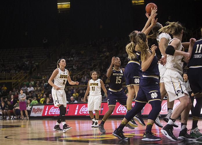 Iowas+no.+2+Ally+Disterhoft+watches+as+her+teammates+and+opposing+team+players+scramble+to+get+the+rebound+of+her+free-throw+during+a+basketball+match+at+the+Carver+Hawkeye+Arena+in+Iowa+City+on+Wednesday%2C+Nov.+30%2C+2016.+Notre+Dame+defeated+Iowa+73-58.+%28The+Daily+Iowan%2FTing+Xuan+Tan%29