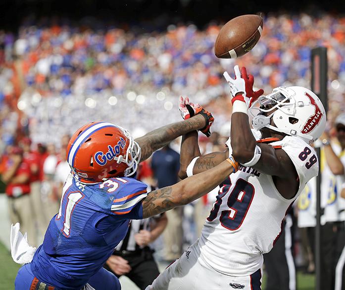 FILE - In this Nov. 21, 2015, file photo, Florida defensive back Jalen Tabor (31) breaks up a pass intended for Florida Atlantic wide receiver Darius James (89) during the second half of an NCAA college football game, in Gainesville, Fla. The Southeastern Conferences two stingiest defenses will take the field in the league championship game.  (AP Photo/John Raoux, File)