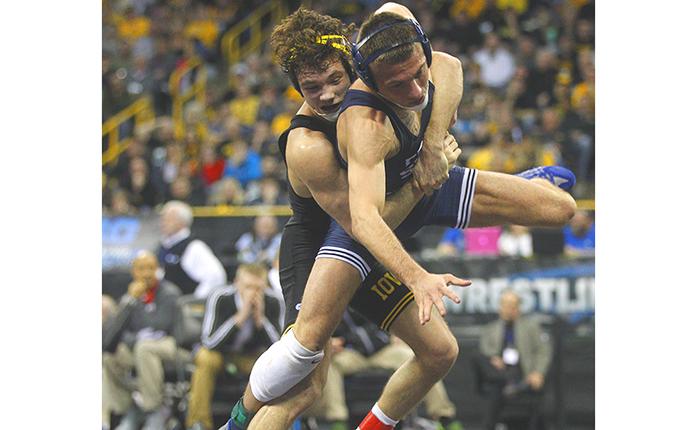 Iowas 125-pounder Thomas Gilman throws Penn States Nico Megaludis during the semifinals of the Big Ten Championships at Carver-Hawkeye Arena on Saturday, March 5, 2016. Megaludis defeated Gilman in overtime 4-3. (The Daily Iowan/Valerie Burke)
