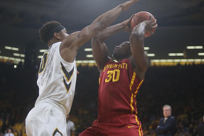 Iowa State forward Deonte Burton tries to get around Iowa forward Ahmad Wagner during the game between rivals Iowa State-Iowa at Carver Hawkeye on Thursday, December 8, 2016. The Hawkeyes went on to upset the Cyclones 78-64. (The Daily Iowan/ Alex Kroeze)