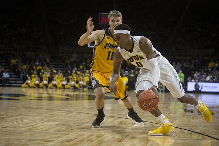 Iowa forward Ahmad Wagner drives past Kennesaw State forward Johannes Nielsen during a basketball game against Kennesaw State in Carver-Hawkeye Arena on Friday, Nov. 11, 2016. The Hawkeyes defeated the Owls, 91-74 in their season opener. (The Daily Iowan/Joseph Cress)