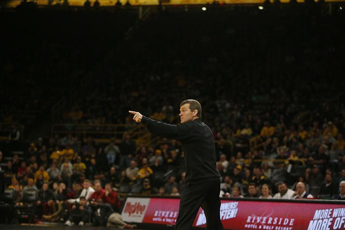 Iowa head coach Tom Brands points at the official during the Iowa-Iowa State match in Carver-Hawkeye Arena on Saturday, Dec. 10, 2016. Iowa defeated Iowa State, 26-9. (The Daily Iowan/Margaret Kispert)