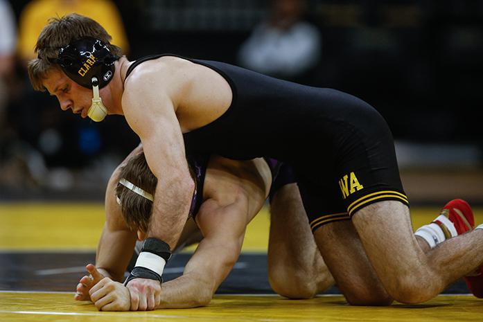 Iowas 133 pound Cory Clark overpowers Cornell Colleges Brody Lamb during the Iowa City Duals at the Carver-Hawkeye Arena, in Iowa City, Iowa  on Friday, Nov. 18, 2016. Iowa out wrestled both Cornell College 45-0 and Iowa Central College 55-0. (The Daily Iowan/Anthony Vazquez)