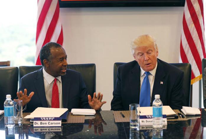 FILE - In this Aug. 25, 2016 photo, former Republican presidential candidate Dr. Ben Carson during Republican presidential candidate Donald Trumps roundtable meeting with the Republican Leadership Initiative in his offices at Trump Tower in New York. Trump has chosen former Campaign 2016 rival Ben Carson to become secretary of the Department of Housing and Urban Development.  (AP Photo/Gerald Herbert)
