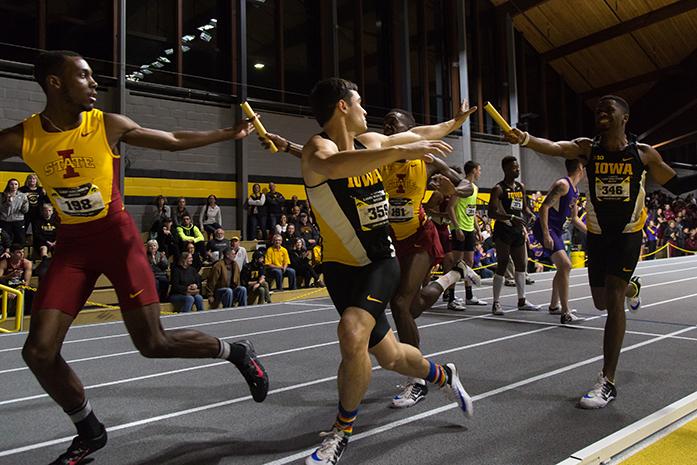Runners hand off the baton during the 400m relay during the Larry Wieczorek Invitational , in the UI Recreation building in Iowa City, Iowa  on Saturday, Jan. 21, 2017. The men and women of the Hawkeyes took the overall win with team scores of 168 and 148.50. (The Daily Iowan/Anthony Vazquez)