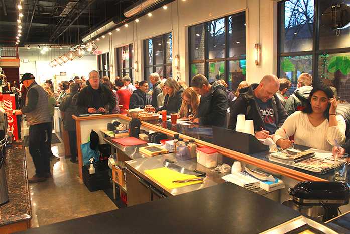 Iowa City BrewLab sees a full house at the Postcards and Pale Ale event on Friday, Jan. 27, 2017. The event gave constituents the chance to contact their representatives by mail on important issues. (The Daily Iowan/Lily Smith)