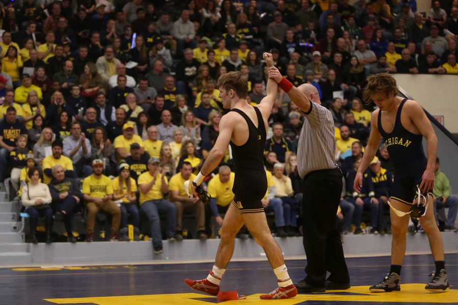 Iowa+133-pounder+Cory+Clark+wins+over+Michigans+Stevan+Micic%2C+2-0+in+Cliff+Keen+Arena.+The+Hawkeyes+beat+the+Wolverines%2C+31-7.+%28The+Daily+Iowan%2F+Margaret+Kispert%29