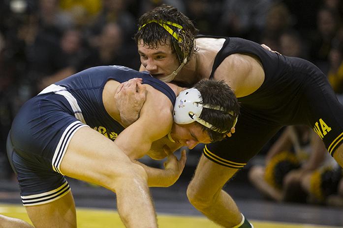Iowas 125-pound Thomas Gilman wrestles Penn States Nick Suriano during the wrestling meet between Iowa and Penn State in Carver-Hawkeye Arena on Friday, Jan. 20, 2017. The Nittany Lions defeated the Hawkeyes, 26-11. (The Daily Iowan/Joseph Cress)
