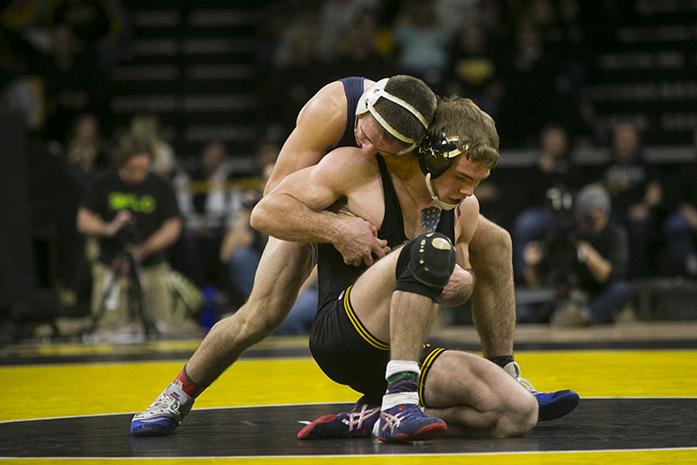 Penn States 149-pound Zain Retheford works the back of Iowas Brandon Sorensen during wrestling meet between Iowa and Penn State in Carver-Hawkeye Arena on Friday, Jan. 20, 2017. The Nittany Lions defeated the Hawkeyes, 26-11. (The Daily Iowan/Joseph Cress)