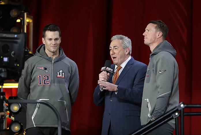 New England Patriots Tom Brady and Atlanta Falcons Matt Ryan are interviewed during opening night for the NFL Super Bowl 51 football game at Minute Maid Park Monday, Jan. 30, 2017, in Houston. (AP Photo/Charlie Riedel)
