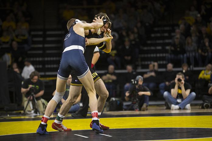 Penn+States+George+Carpenter+pushes+Iowas+Cory+Clark+during+wrestling+meet+between+Iowa+and+Penn+State+in+Carver-Hawkeye+Arena+on+Friday%2C+Jan.+20%2C+2017.+The+Nittany+Lions+defeated+the+Hawkeyes%2C+26-11.+%28The+Daily+Iowan%2FJoseph+Cress%29