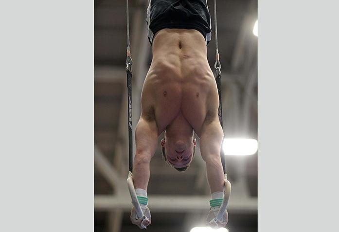 Iowa gymnast Dylan Ellsworth performs his routine on the rings at the Black and Gold Intrasquad meet at the Field House on Saturday, Dec. 6, 2014. The Black team defeated Gold team 253.55 to 251.40. (The Daily Iowan/Valerie Burke)